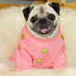 A fawn female pug wearing a Pink Smiley Face Jumper